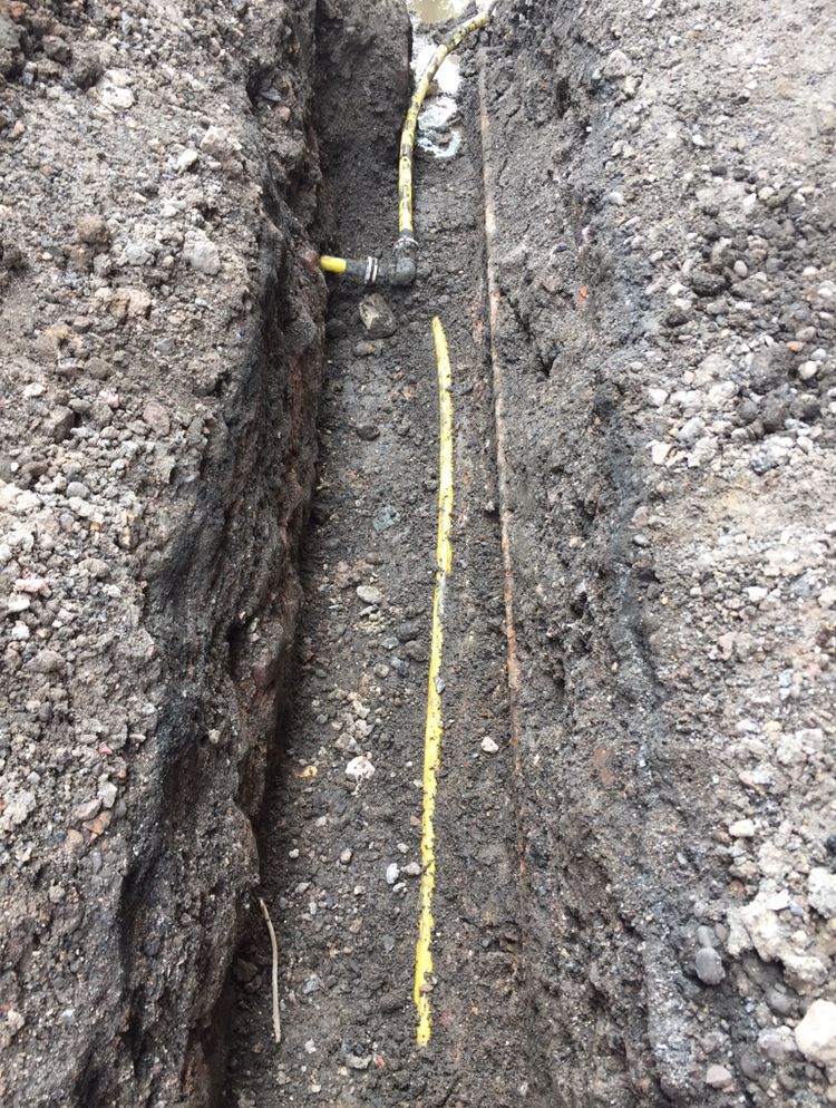 Trial dig exposing a gas service to confirm its route