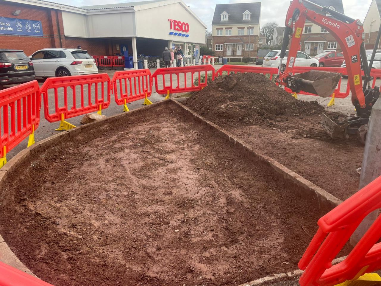 Flower bed excavated to create space for a new footpath in Barrow-in-Furness