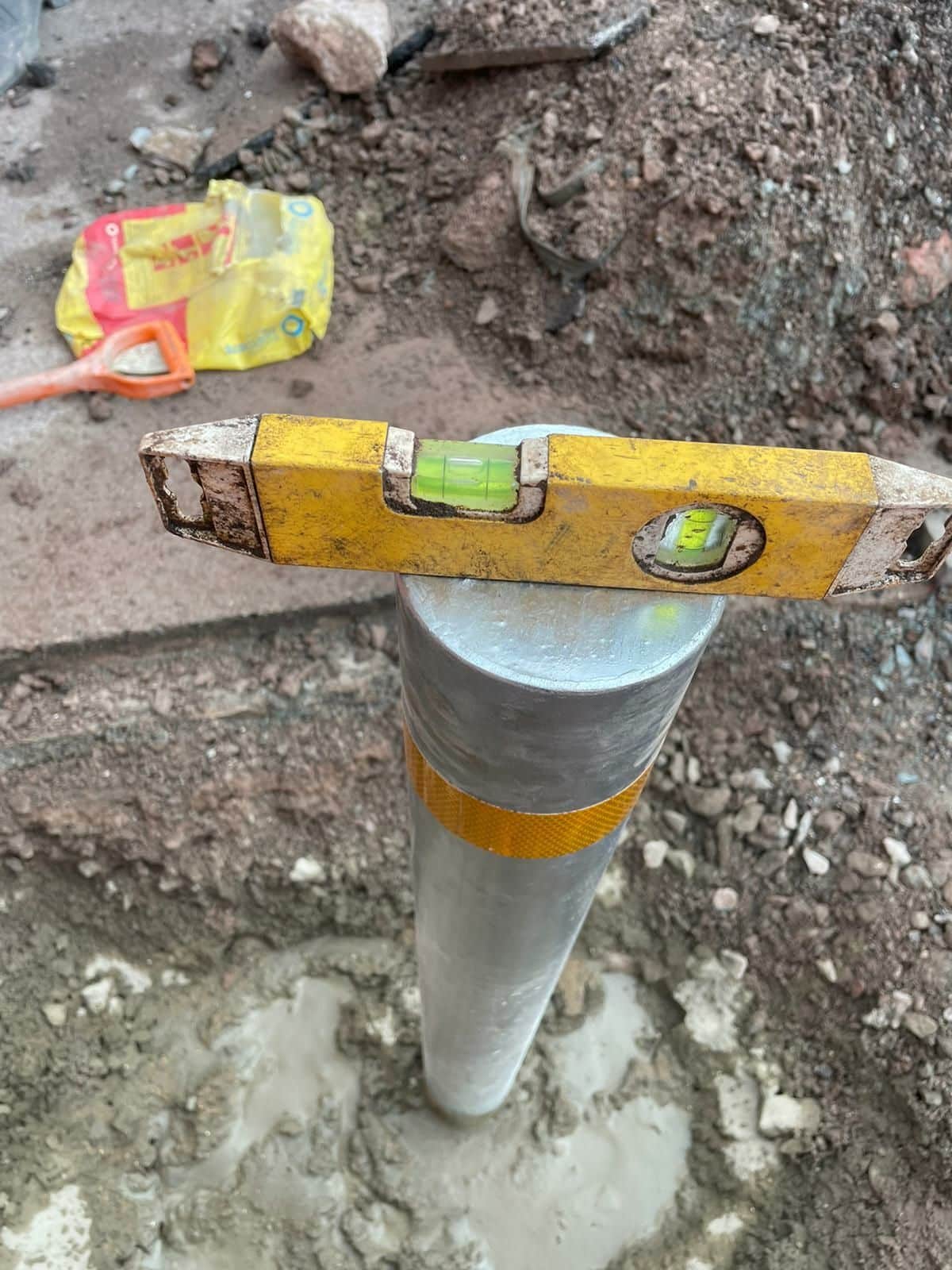 Bollard installation being checked for level in Barrow-in-Furness