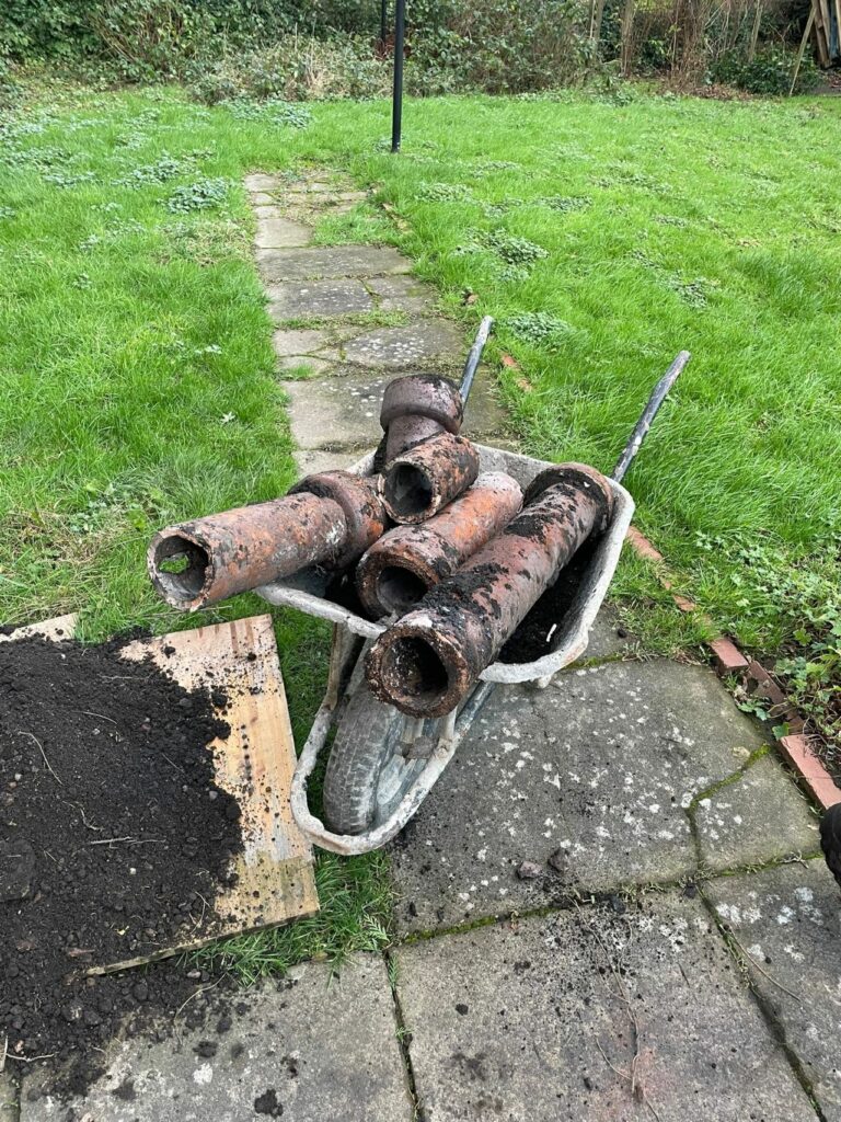 Damaged underground drainage pipework removed during a drain repair in Glasgow