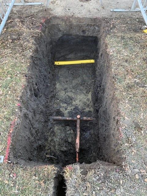Trial dig excavated to expose utilities