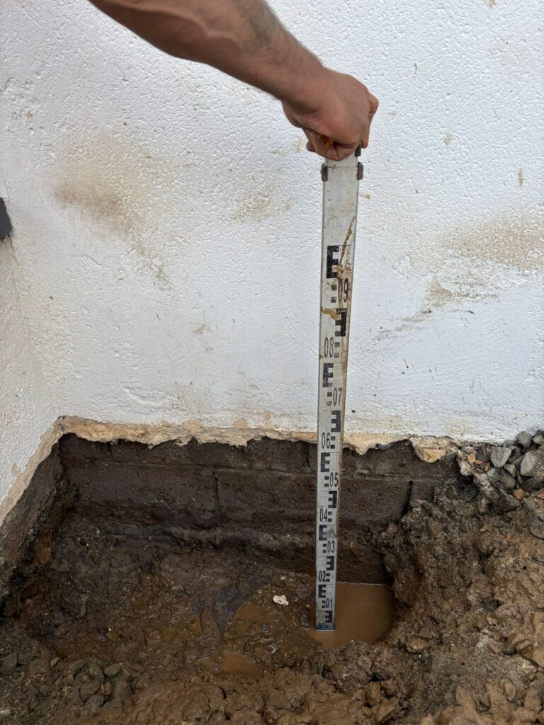 Trial dig excavated to expose foundation